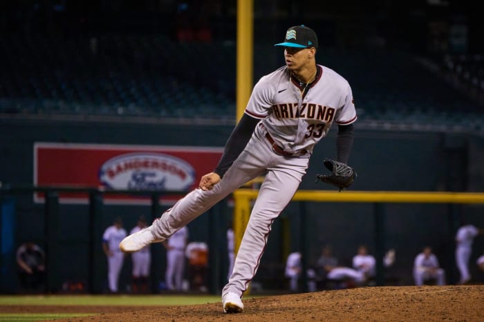 Oct 15, 2022; Phoenix, AZ, USA; Salt River Rafters pitcher Justin Martinez (33) pitches against the Surprise Saguaros at Chase Field. Mlb Dbacks Fall League Prospects
